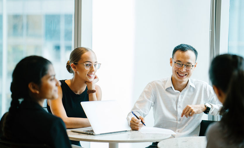 YourOpportunity_GroupMeeting_834x506_V1 employees conference room meeting