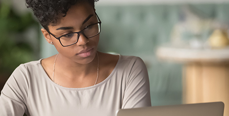 women watching webinar on computer